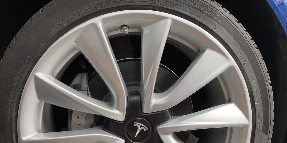 Before: Tesla Model 3 20-inch Induction wheel with curb rash